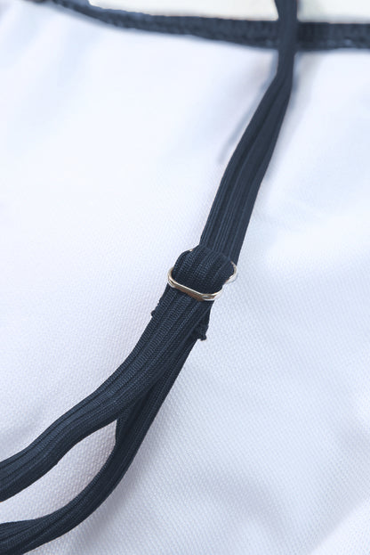 Maillot de bain une pièce bleu marine côtelé avec cordon de serrage et découpes sur les côtés