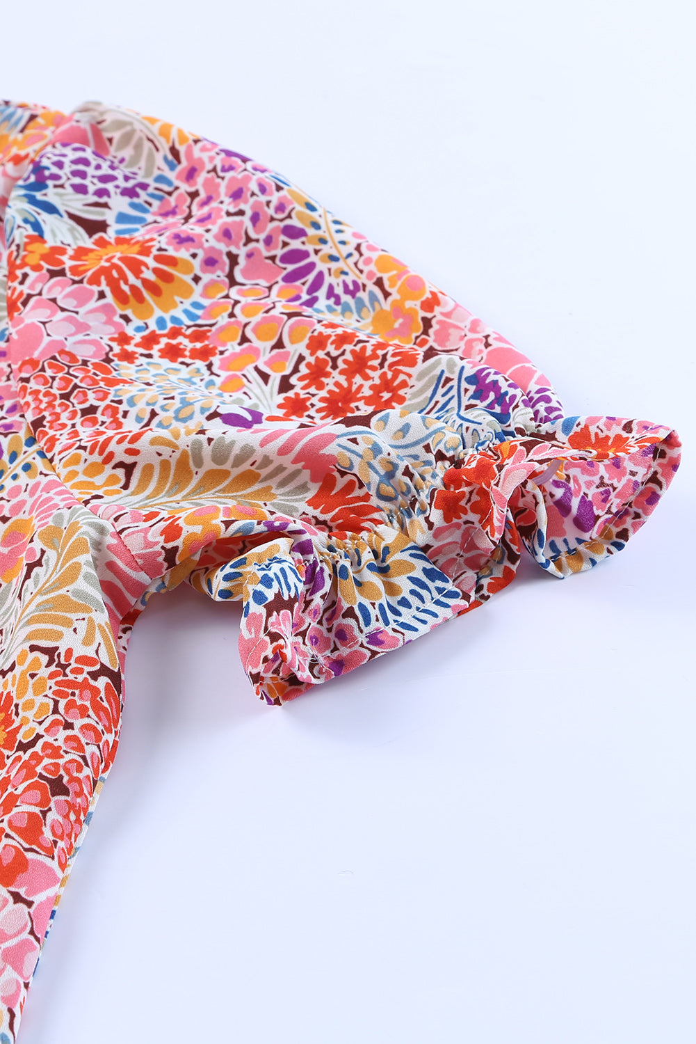 Chemisier à manches bouffantes et motifs floraux multicolores 