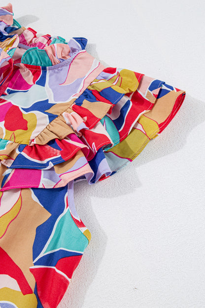 Chemisier rose à imprimé abstrait, manches volantées, col en V fendu et noué