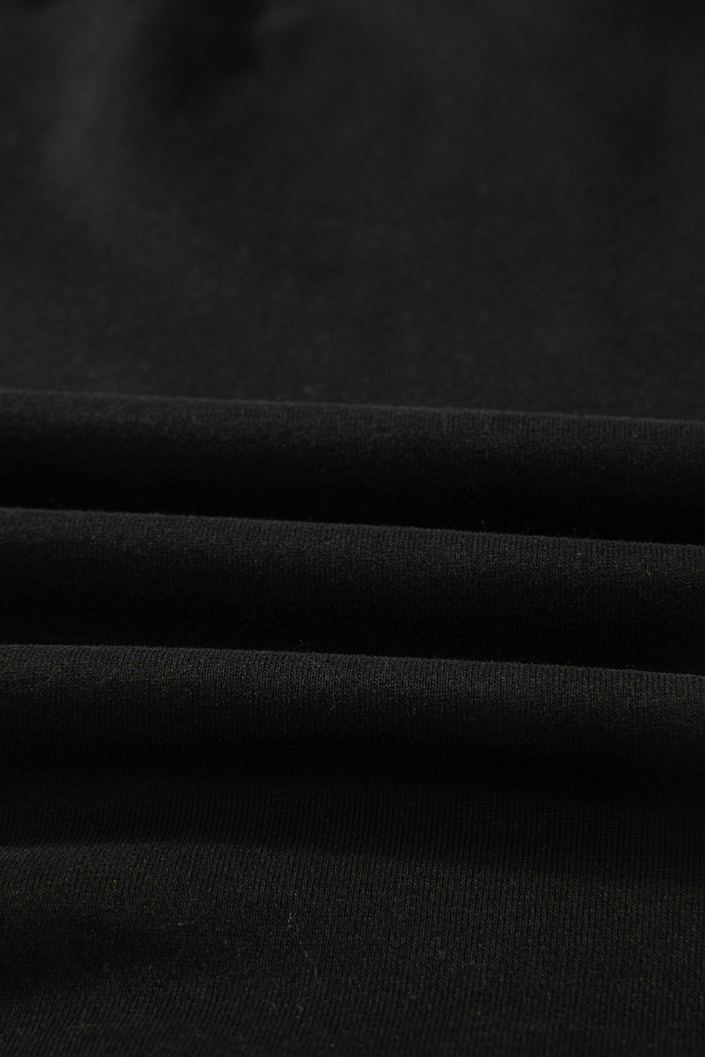 Sweat-shirt noir uni à col rond et ourlet haut-bas