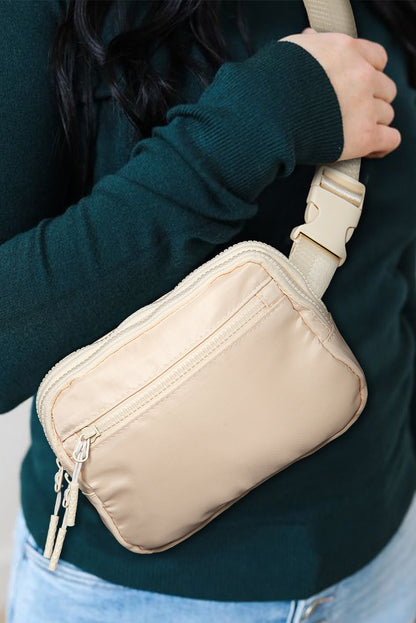 Sac bandoulière carré zippé à large ceinture