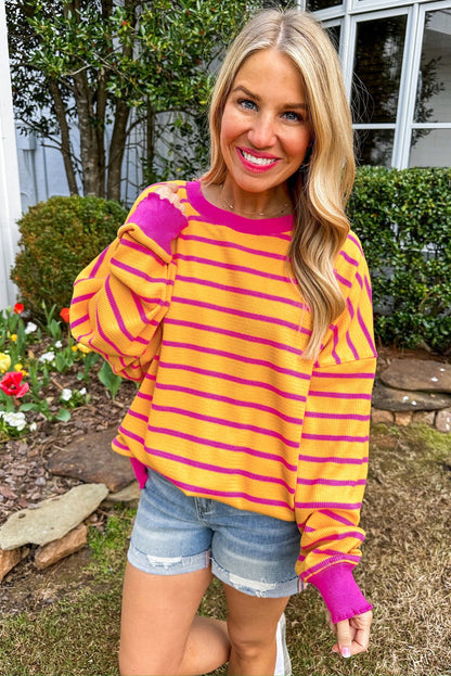 Pull ample à rayures orange, col rond, épaules tombantes