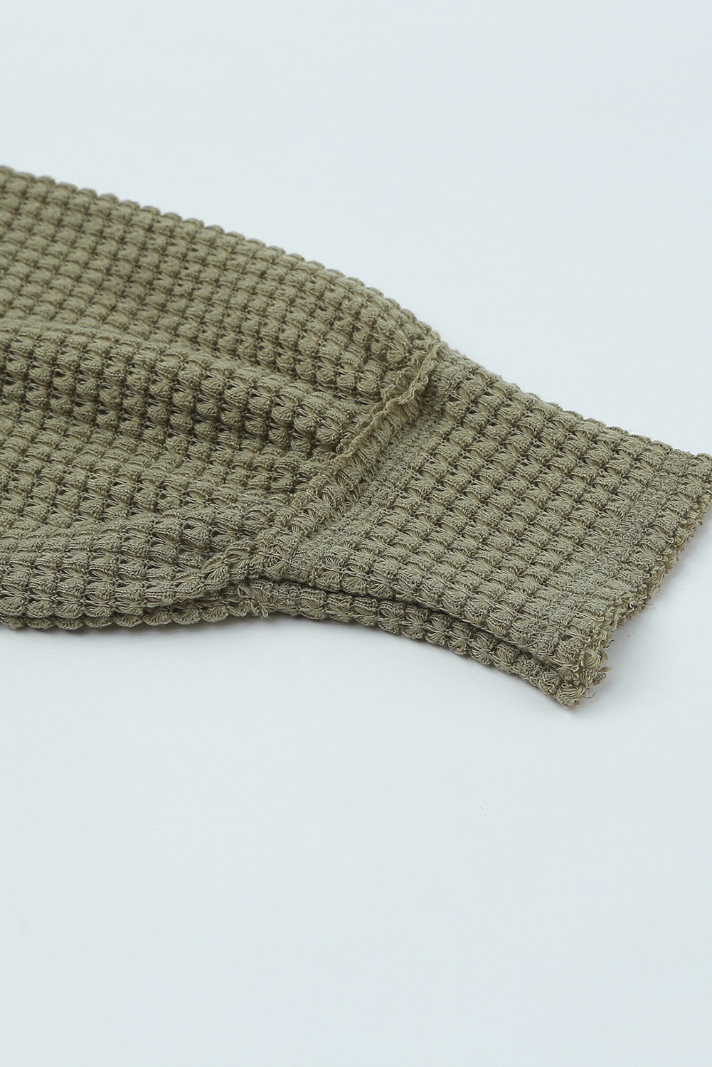 Haut ample en tricot gaufré à col fendu et poches