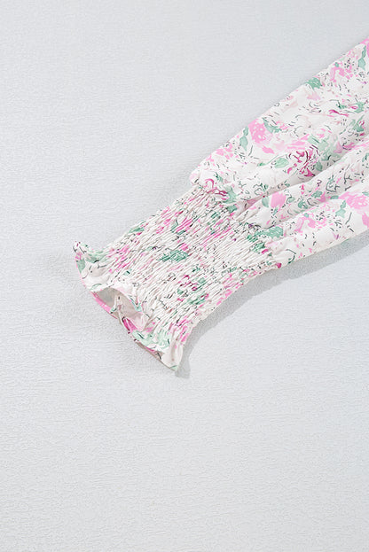 Chemisier babydoll rose à imprimé floral, manches ballon froncées, dos troué