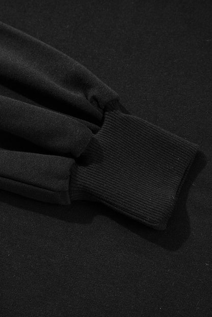 Sweat-shirt noir à col rond et épaules tombantes avec coutures apparentes et fentes