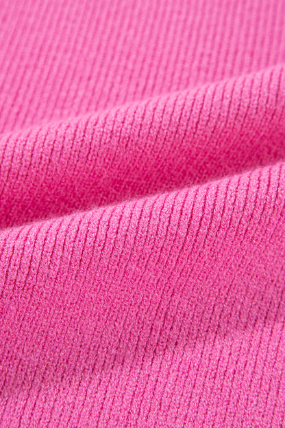 Pull rose en tricot côtelé à manches contrastées