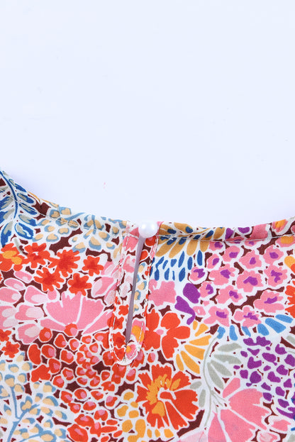 Chemisier à manches bouffantes et motifs floraux multicolores 