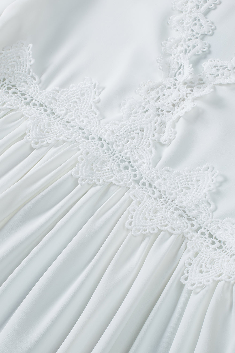 Chemisier à manches cloche et empiècements en crochet