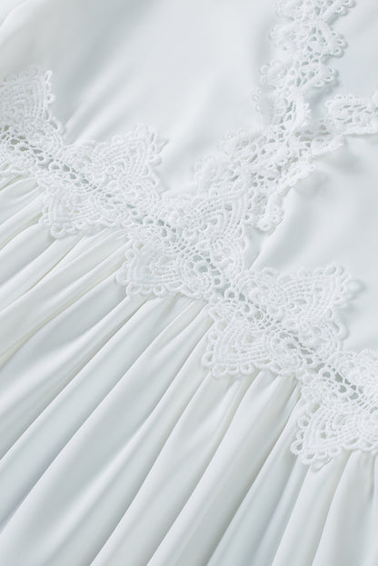 Chemisier à manches cloche et empiècements en crochet