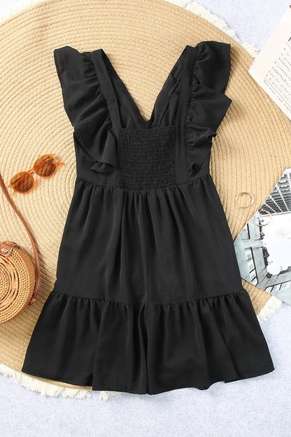 Mini-robe à volants, col en V et dos froncé