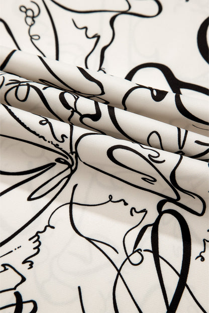 Chemisier beige à col rond et manches ballon à imprimé abstrait