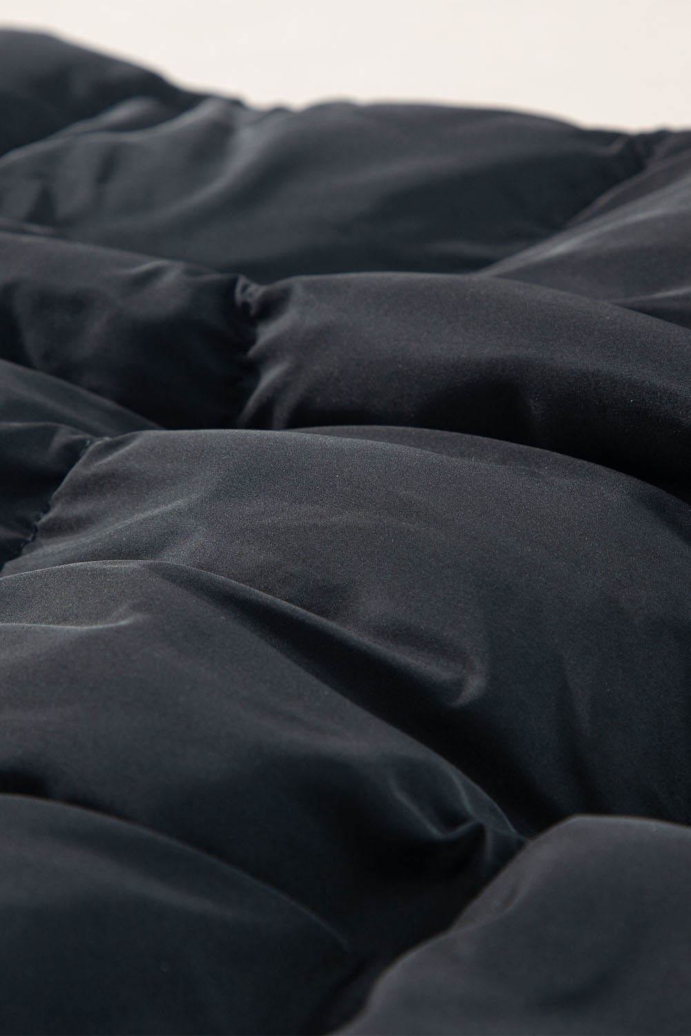 Gilet long noir coupe-vent avec fermeture éclair et poches