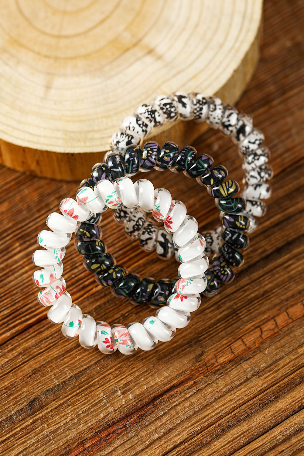 Coletero con cordón para teléfono floral negro