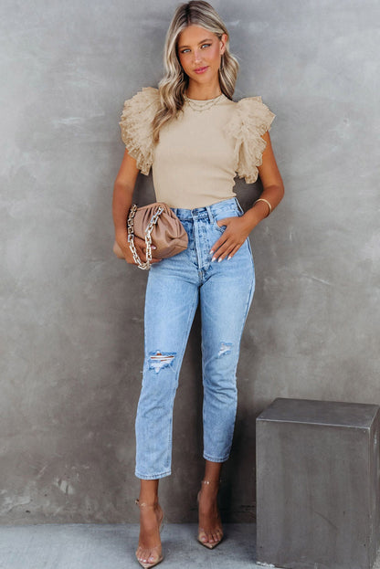 Haut en maille côtelée à volants et manches en maille à pois