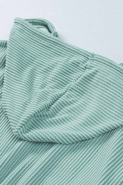 Sudadera con capucha holgada y cuello en V de canalé