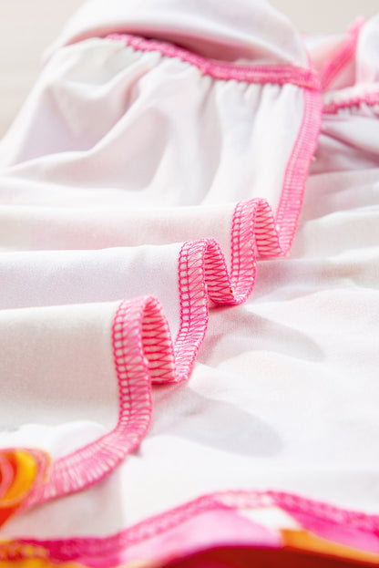 Chemisier babydoll orange à imprimé abstrait, manches 3/4, col en V et volants