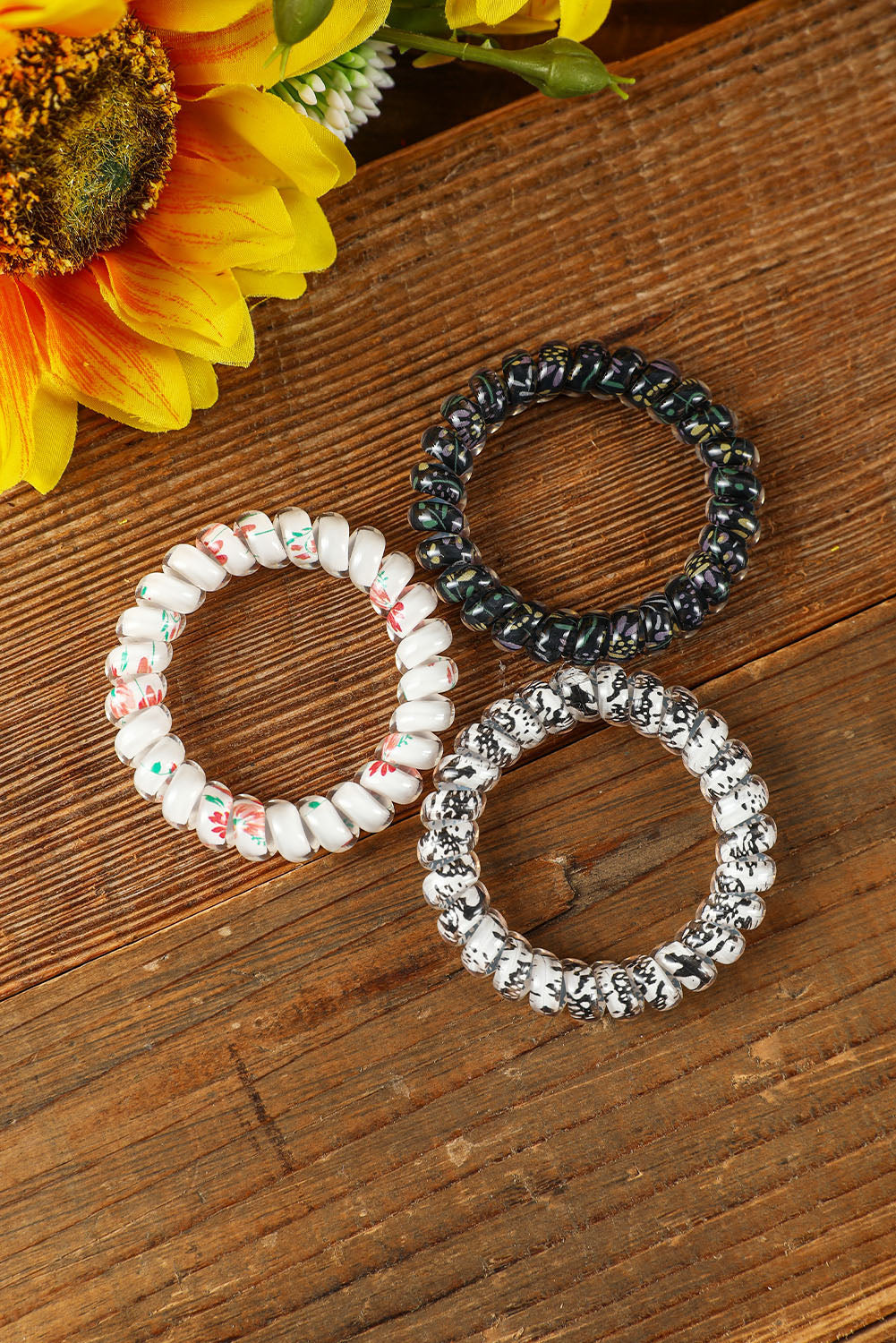 Coletero con cordón para teléfono floral negro