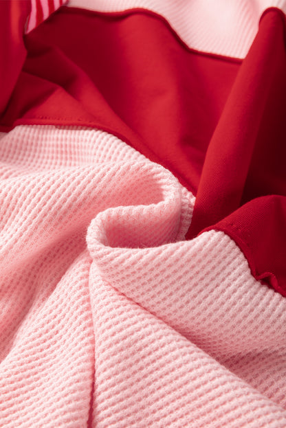 Haut texturé à manches rayées et blocs de couleurs à motif floral rose