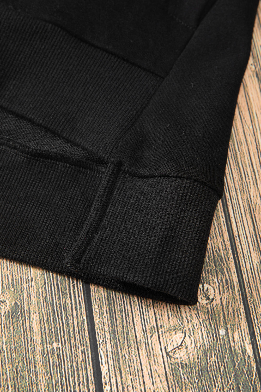 Sweat-shirt noir uni à col rond et ourlet haut-bas