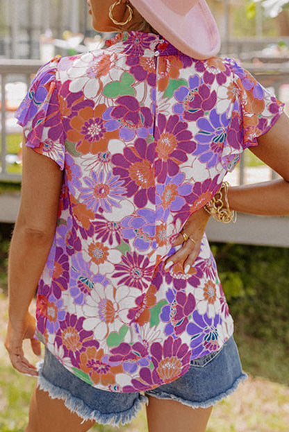 Top floral con mangas acampanadas y cuello levantado multicolor