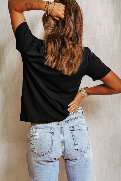 T-shirt ras du cou noir à gros nœud de Noël