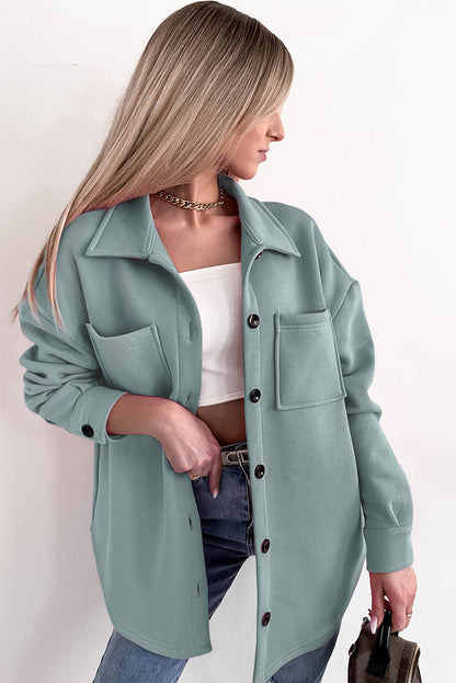 Veste-chemise boutonnée à manches longues et poches de couleur unie noire 