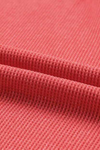 Top tipo jersey con abertura lateral y punto tipo gofre 