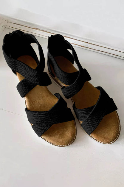 Sandalias de cuña baja con cremallera y tiras cruzadas en beige