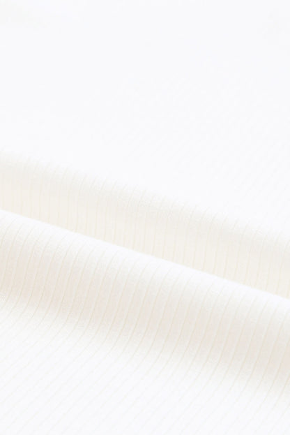 Haut en maille côtelée à volants et manches en maille à pois