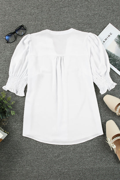 Blusa con cuello en V y media manga de color liso