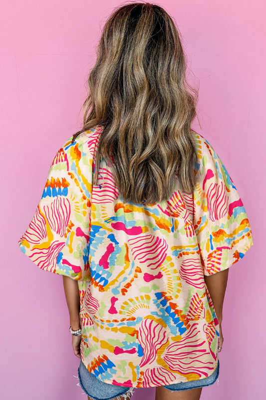 Chemisier orange à manches courtes et col en V, imprimé abstrait