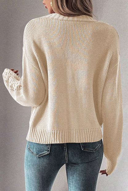 Cardigan beige en maille ouverte à épaules tombantes