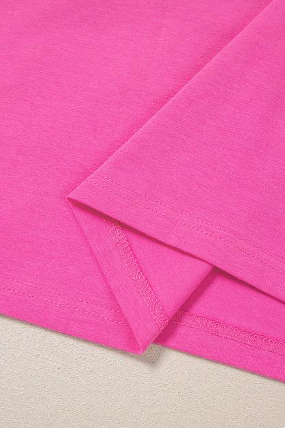 Haut rose à manches courtes et col fendu avec bordure contrastante, grande taille