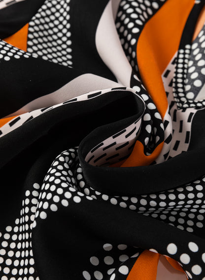 Chemisier orange à imprimé géométrique et col en V cranté