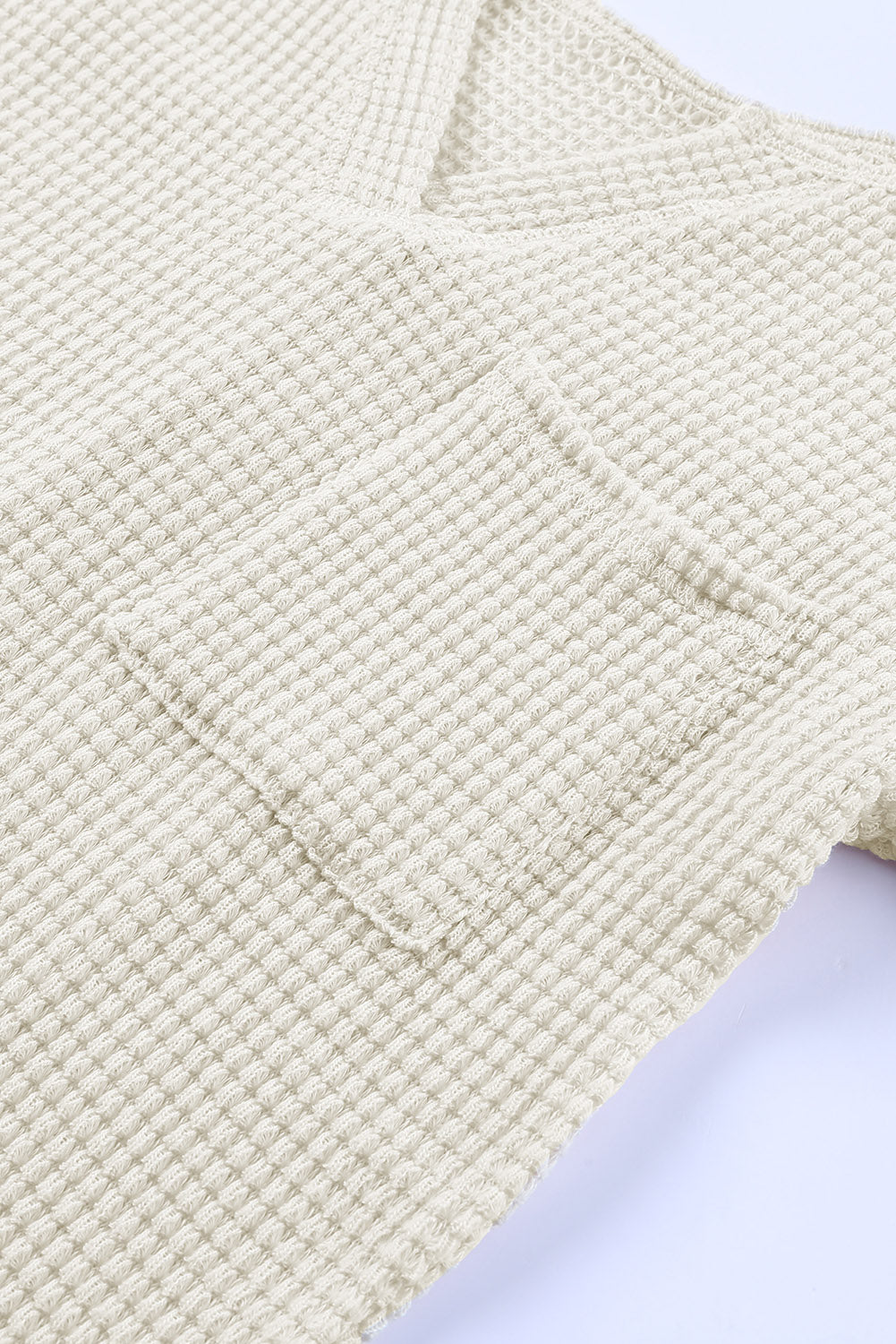 Haut ample en tricot gaufré à col fendu et poches