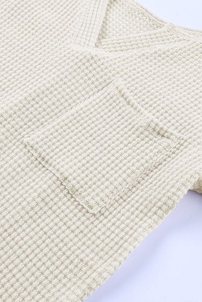 Haut ample en tricot gaufré à col fendu et poches