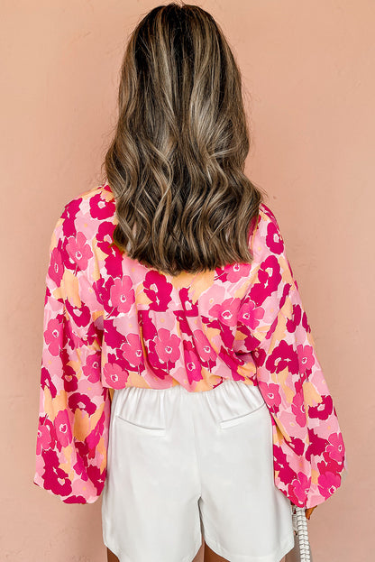 Chemise boutonnée à manches bouffantes et imprimé floral rose