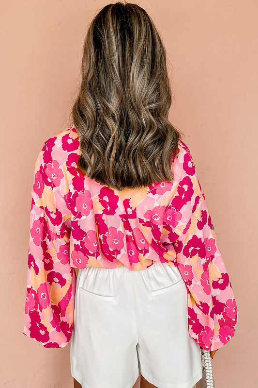 Chemise boutonnée à manches bouffantes et imprimé floral rose