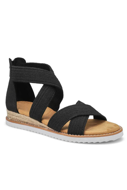 Sandalias de cuña baja con cremallera y tiras cruzadas en beige