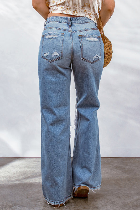 Jeans anchos con rodillas abiertas y desgastados 