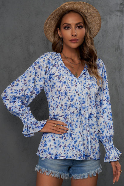 Blusa con botones y cuello en V con estampado floral 