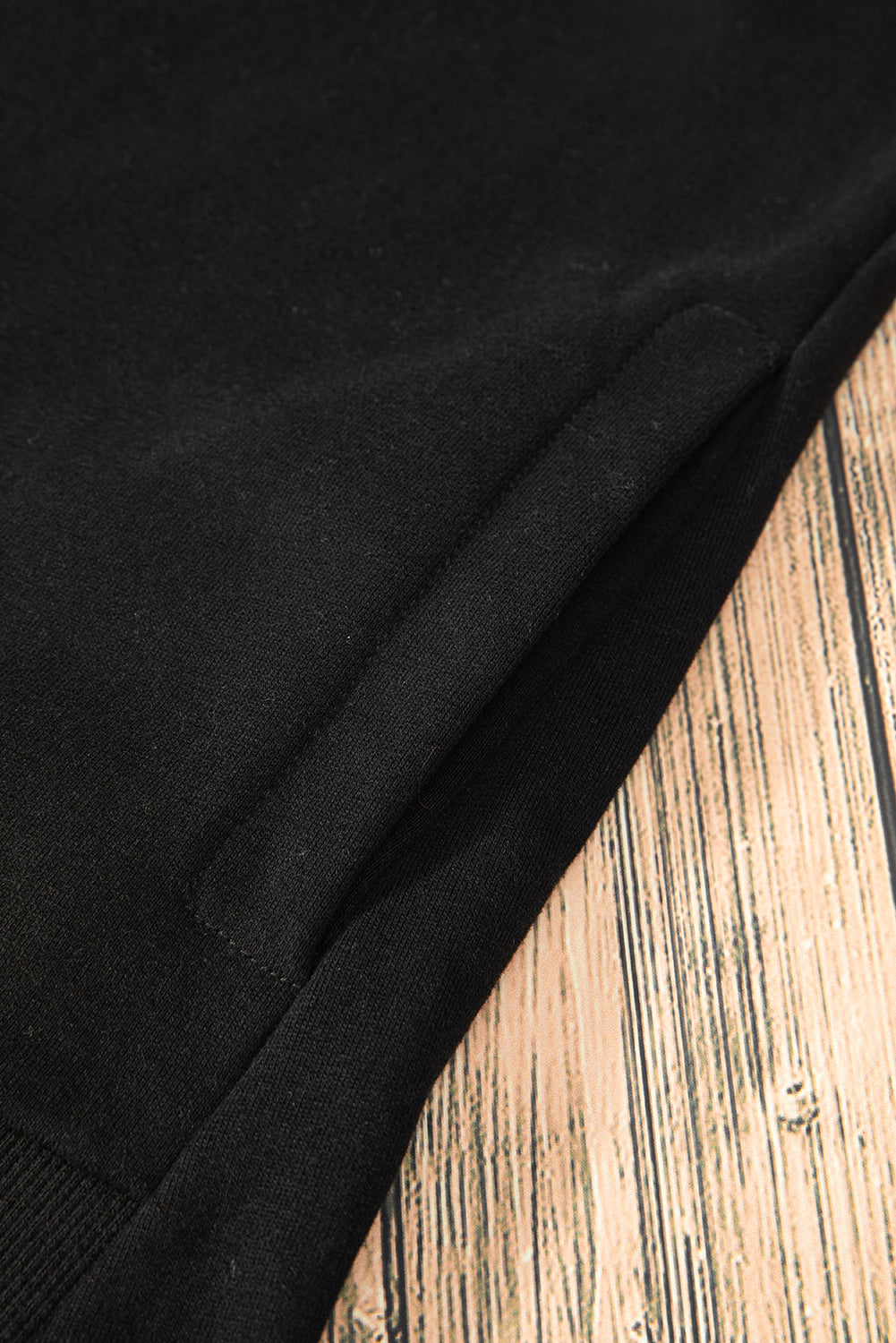 Sweat-shirt noir uni à col rond et ourlet haut-bas