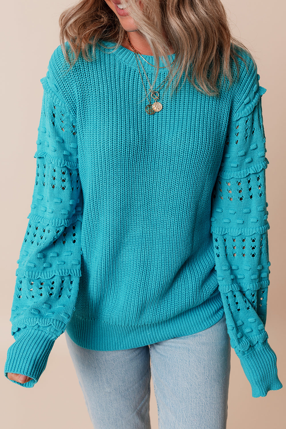 Pull turquoise à volants et manches bouffantes
