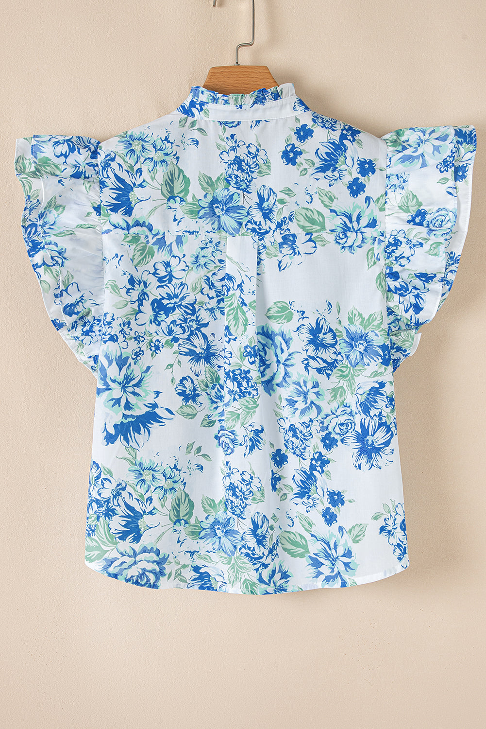 Chemise boutonnée à volants et imprimé floral bleu ciel