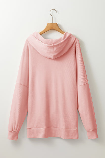 Sweat à capuche surdimensionné rose clair en tricot gaufré doublé polaire à col montant