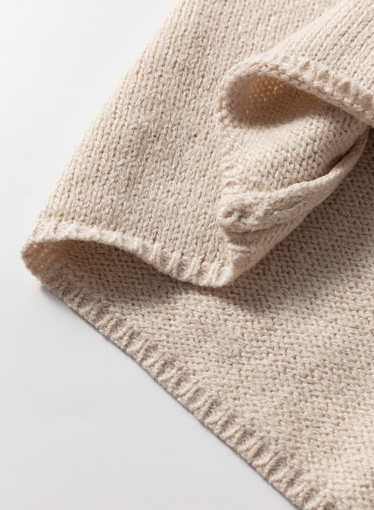 Cardigan long en maille beige ouvert sur le devant avec poches latérales