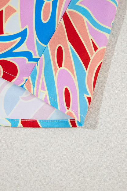 Chemisier rose à imprimé abstrait, col à volants et manches à volants