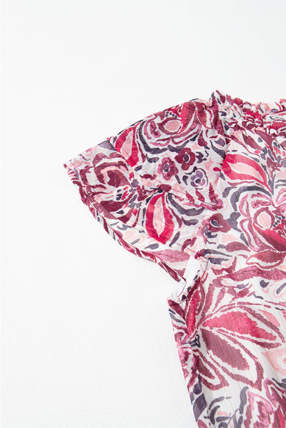 Chemisier blanc à volants et manches courtes, col en V et fleurs