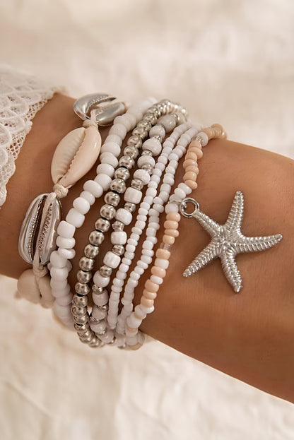 Ensemble de 7 bracelets blancs en perles de coquillages et étoiles de mer