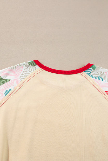 Haut beige à manches raglan et bordures colorblock, imprimé patchwork et nœud papillon